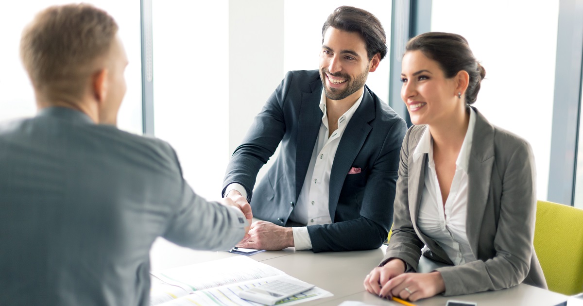 Business people meet and shake hands