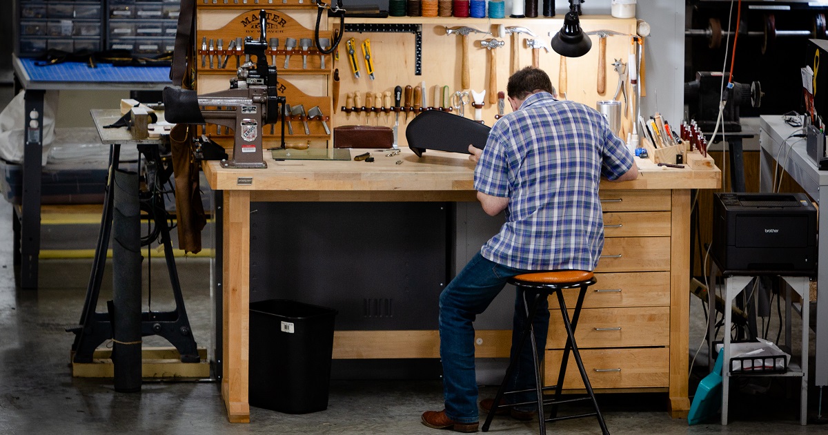 Manufacturing employee works at a desk