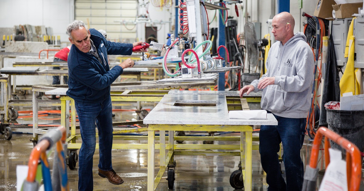 Manager inspects workplace safety equipment