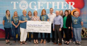 MEM employees present donation check to The Food Bank for Central and Northeast Missouri