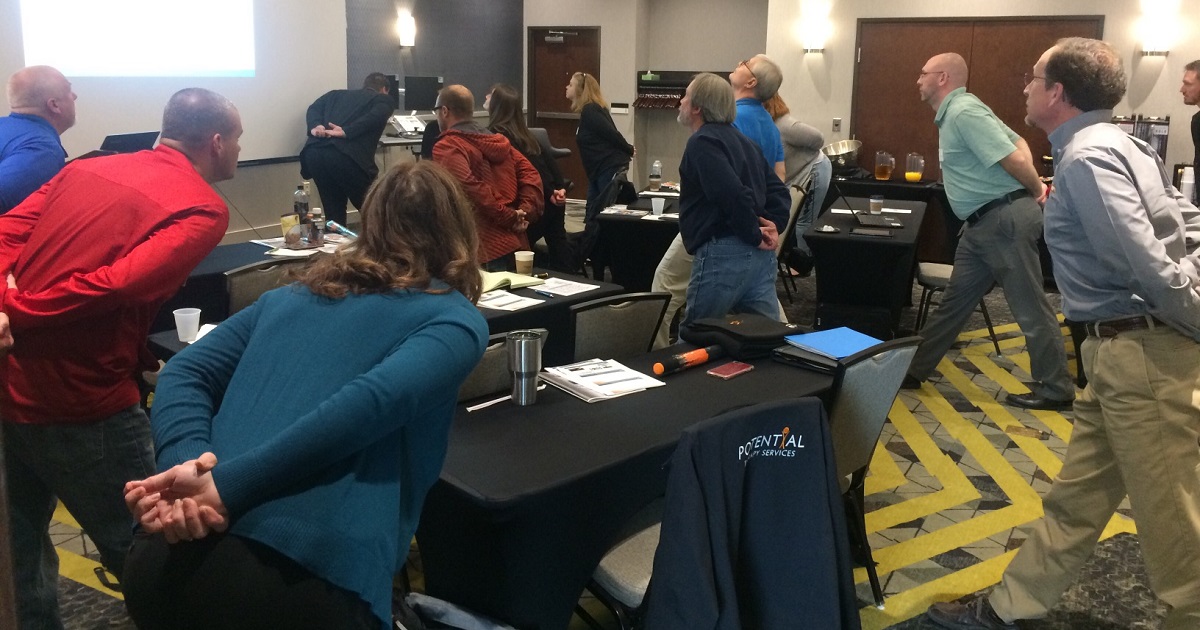 Flint Walton leads an ergonomics stretching seminar